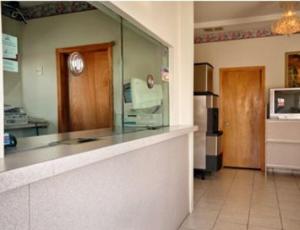 a kitchen with a counter top and a refrigerator at Knights Inn South Hackensasck in South Hackensack