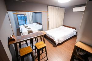 Postel nebo postele na pokoji v ubytování Mitomi inn