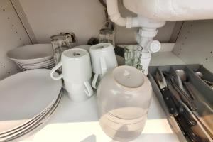 a kitchen counter with a sink and some appliances at Charmant appartement à Magny-le-Hongre, 35 m², au calme in Magny-le-Hongre