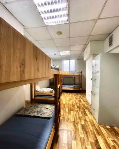 Postel nebo postele na pokoji v ubytování Hostel Cozzydine