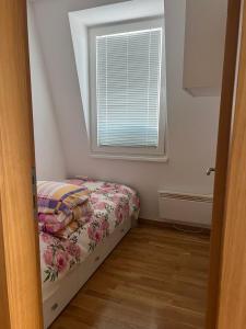 Ένα ή περισσότερα κρεβάτια σε δωμάτιο στο Bjelasnica Mountain Stay