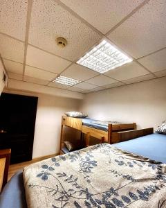 Postel nebo postele na pokoji v ubytování Hostel Cozzydine
