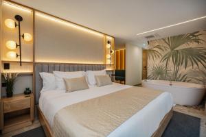 A bed or beds in a room at LIN Boutique Hotel by HOUSY HOST