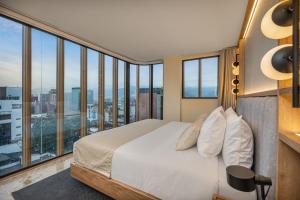 A bed or beds in a room at LIN Boutique Hotel by HOUSY HOST