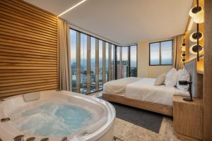 A bed or beds in a room at LIN Boutique Hotel by HOUSY HOST