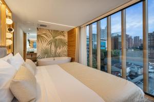 A bed or beds in a room at LIN Boutique Hotel by HOUSY HOST