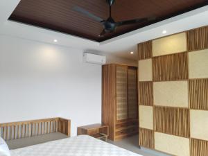 Sawitri Anandhita Luxury Villas客房内的一张或多张床位