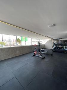 a room with a gym with a bike in it at Flat Mont Blanc - Perto de Tudo! in São Luís