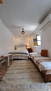 Postel nebo postele na pokoji v ubytování Maison Imane Marrakech + 37 fotografií