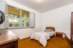 Postel nebo postele na pokoji v ubytování Memora Guesthouse Curitiba - Quartos em Casa próximo ao Parque Bacacheri