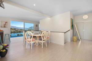 a kitchen and dining room with a table and chairs at Amazing room #3 in Queenstown