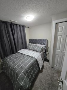Ένα ή περισσότερα κρεβάτια σε δωμάτιο στο 2 Bedroom Secondary Suite