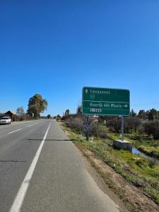 a street sign on the side of a road at Cabañas Hostalner in Carrizales