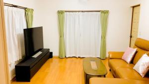 TV o dispositivi per l'intrattenimento presso BLO富津市大堀-Private Villa in Futtsu