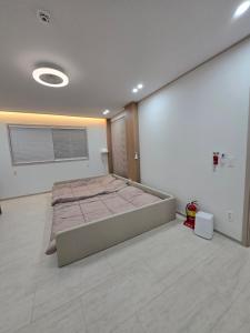 Postel nebo postele na pokoji v ubytování Daori Pension