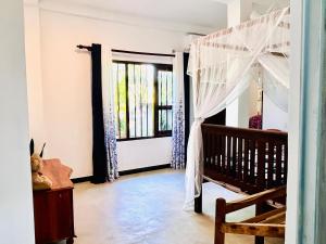 Postel nebo postele na pokoji v ubytování Wasana Ocean View Villa Mirissa
