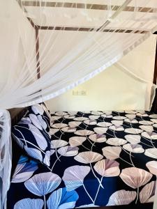 Postel nebo postele na pokoji v ubytování Wasana Ocean View Villa Mirissa