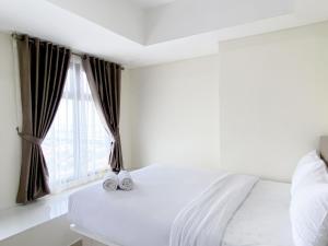 En eller flere senge i et værelse på Well Furnished and Cozy 2BR Pollux Chadstone Apartment By Travelio