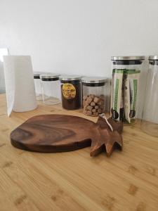 a wooden cutting board sitting on top of a table at Sunrise Lodge in Uturoa +15 photos