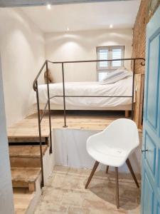 Postel nebo postele na pokoji v ubytování Appartement spacieux à Algajola
