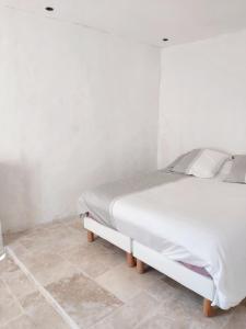 Postel nebo postele na pokoji v ubytování Appartement spacieux à Algajola