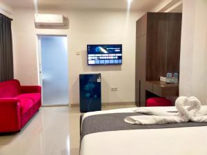 TV a/nebo společenská místnost v ubytování Carstenzs Home Kuta