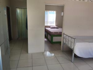 Ένα ή περισσότερα κρεβάτια σε δωμάτιο στο Sunset House