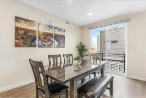 a dining room with a table and chairs and a window at Here Comes the Sun condo in Atkinville
