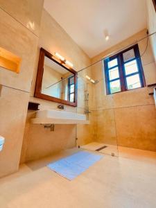 a bathroom with a sink and a mirror at Madiha Venus in Matara +44 photos