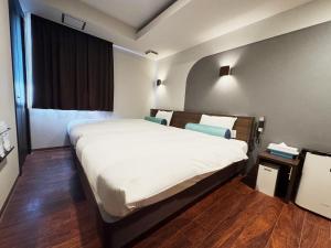 Postel nebo postele na pokoji v ubytování RE Hotel 谷町9丁目2