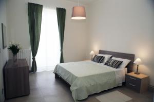 Säng eller sängar i ett rum på Apartment Corso Cavour