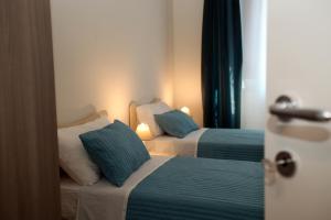 Posteľ alebo postele v izbe v ubytovaní Apartment Corso Cavour
