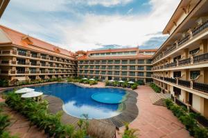 a courtyard with a swimming pool in a hotel at Bayon Era Hotel in Siem Reap