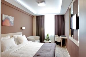 Katil atau katil-katil dalam bilik di Garni Hotel Aveny