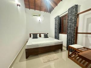 Postel nebo postele na pokoji v ubytování Aroma Villa Homestay