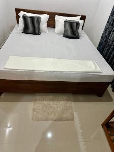 Postel nebo postele na pokoji v ubytování Aroma Villa Homestay