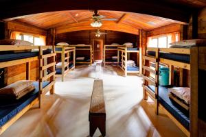 a room with several bunk beds in a cabin at HI Athabasca Falls - Hostel in Jasper
