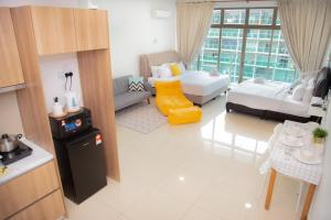 a small living room with a couch and a table at -Mount Austin IKEA, AEON 10mins -Pool View- B215 in Johor Bahru +31 photos