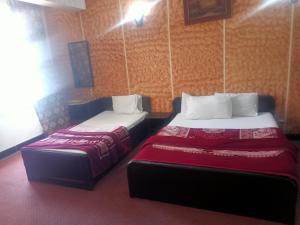 Postel nebo postele na pokoji v ubytování Hotel Al badar