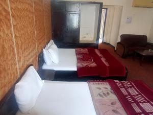 Postel nebo postele na pokoji v ubytování Hotel Al badar
