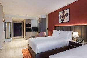 Doubletree By Hilton Amman Hotel & Residences客房内的一张或多张床位