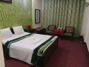 Postel nebo postele na pokoji v ubytování Hotel Al badar