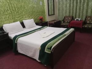 Postel nebo postele na pokoji v ubytování Hotel Al badar