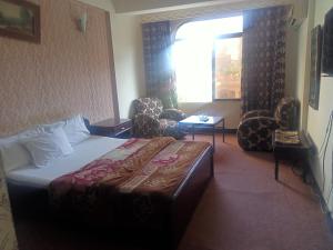 Postel nebo postele na pokoji v ubytování Hotel Al badar