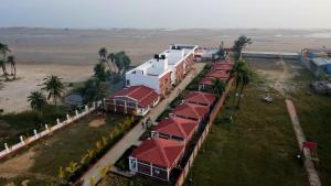an overhead view of a row of houses with red roofs at Ricardo Beach Resort in Mandarmoni