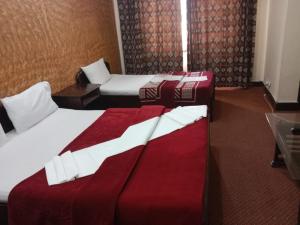 Postel nebo postele na pokoji v ubytování Hotel Al badar