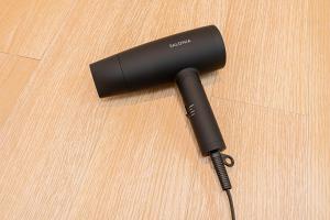 a black flashlight sitting on top of a table at Mori hotel Akihabara 2 in Tokyo