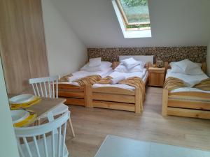 Postel nebo postele na pokoji v ubytování Apartamenty u Joli