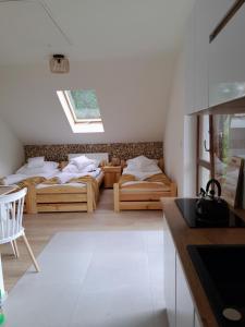 Postel nebo postele na pokoji v ubytování Apartamenty u Joli