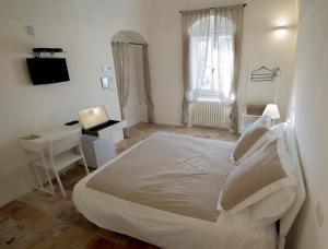 Кровать или кровати в номере Giardini di Pietra